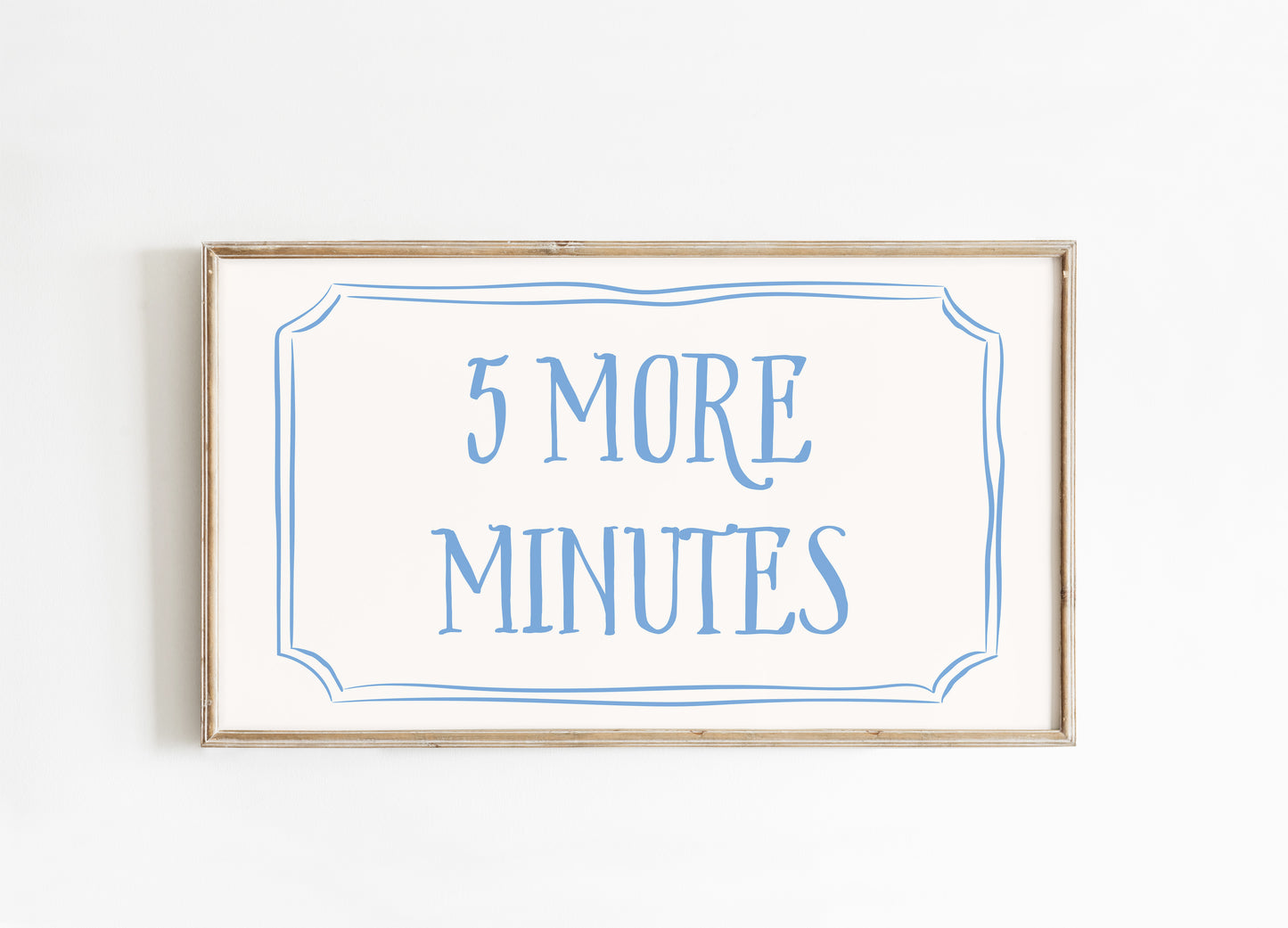 Framed sign with '5 More Minutes' text on a white background