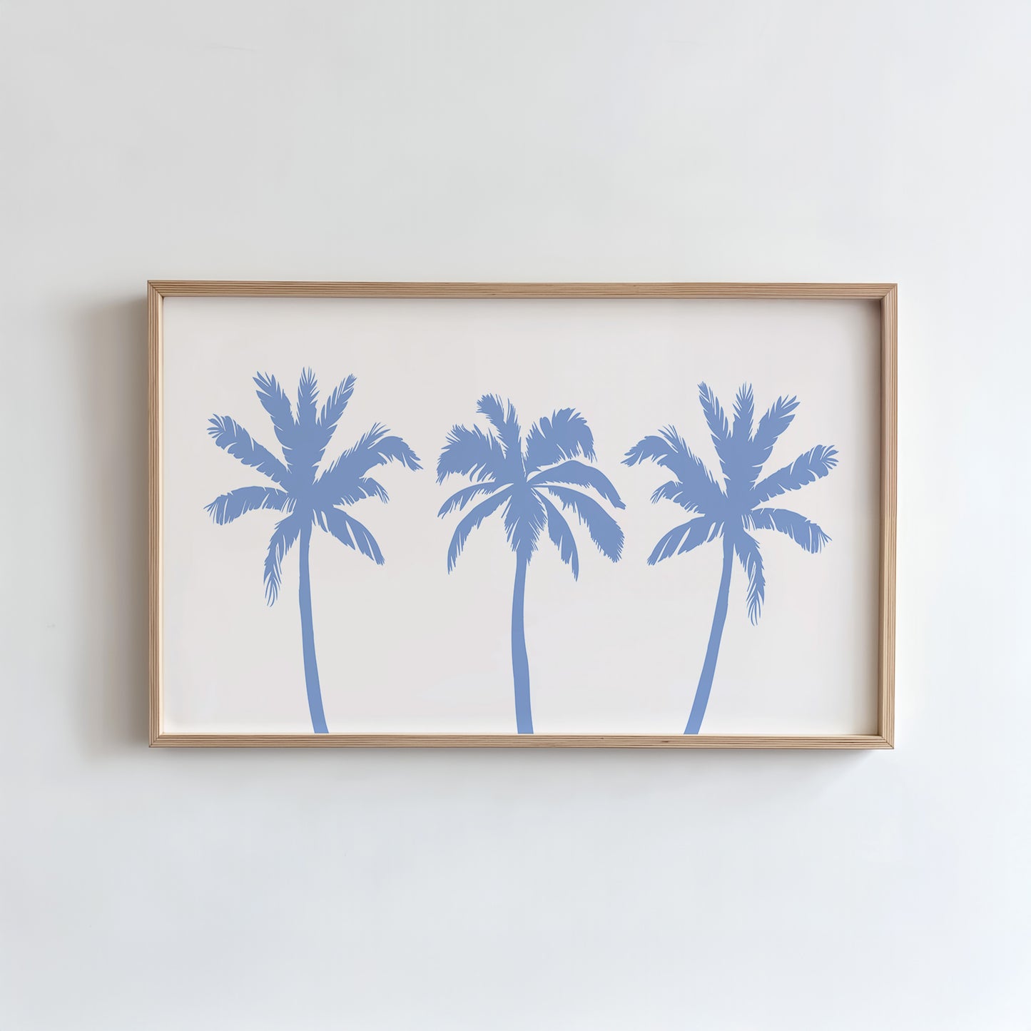 Framed artwork with blue palm tree silhouettes on a white background