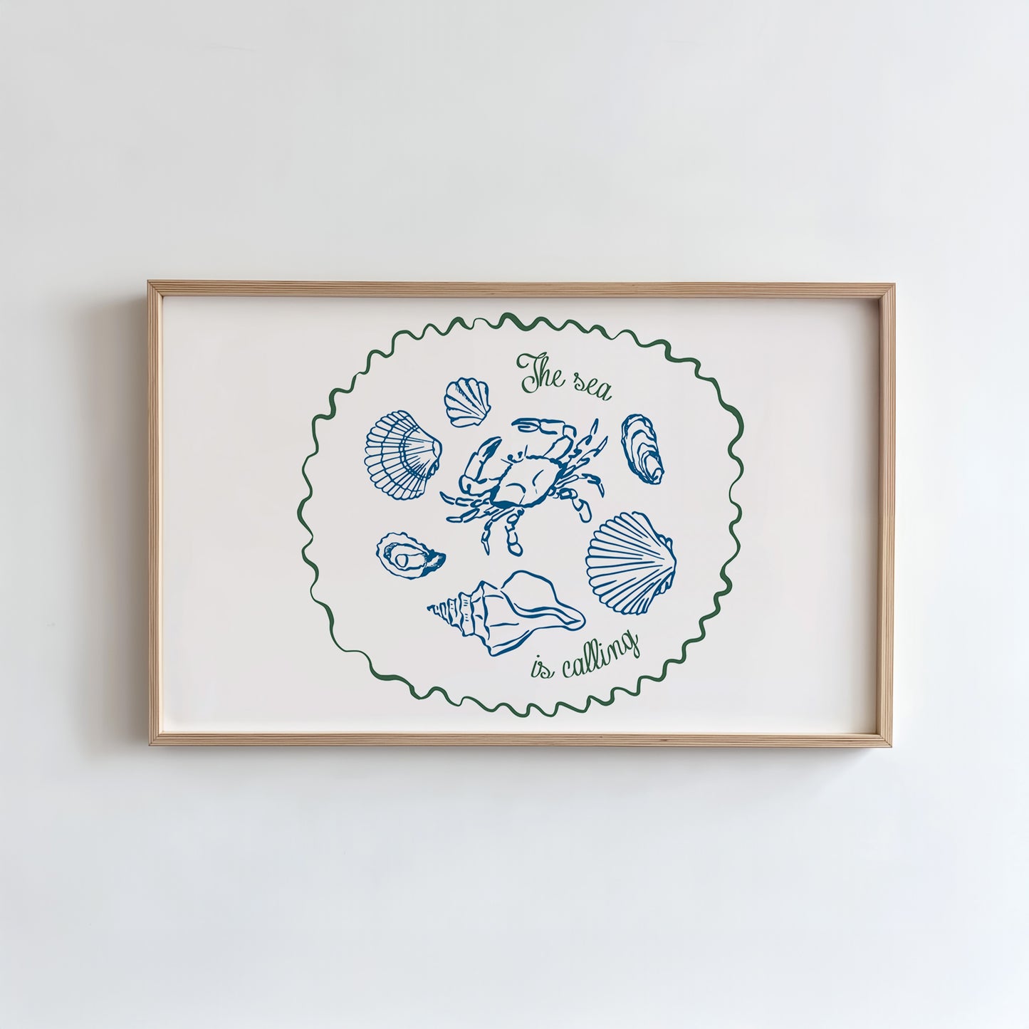 Framed artwork with coastal illustrations and text on a white wall