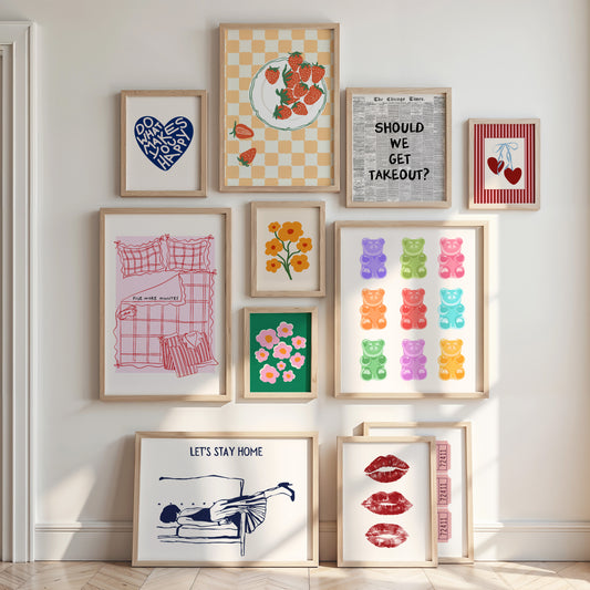 Collection of framed artworks on a wall