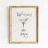 Framed artwork with a martini glass and text on a white background