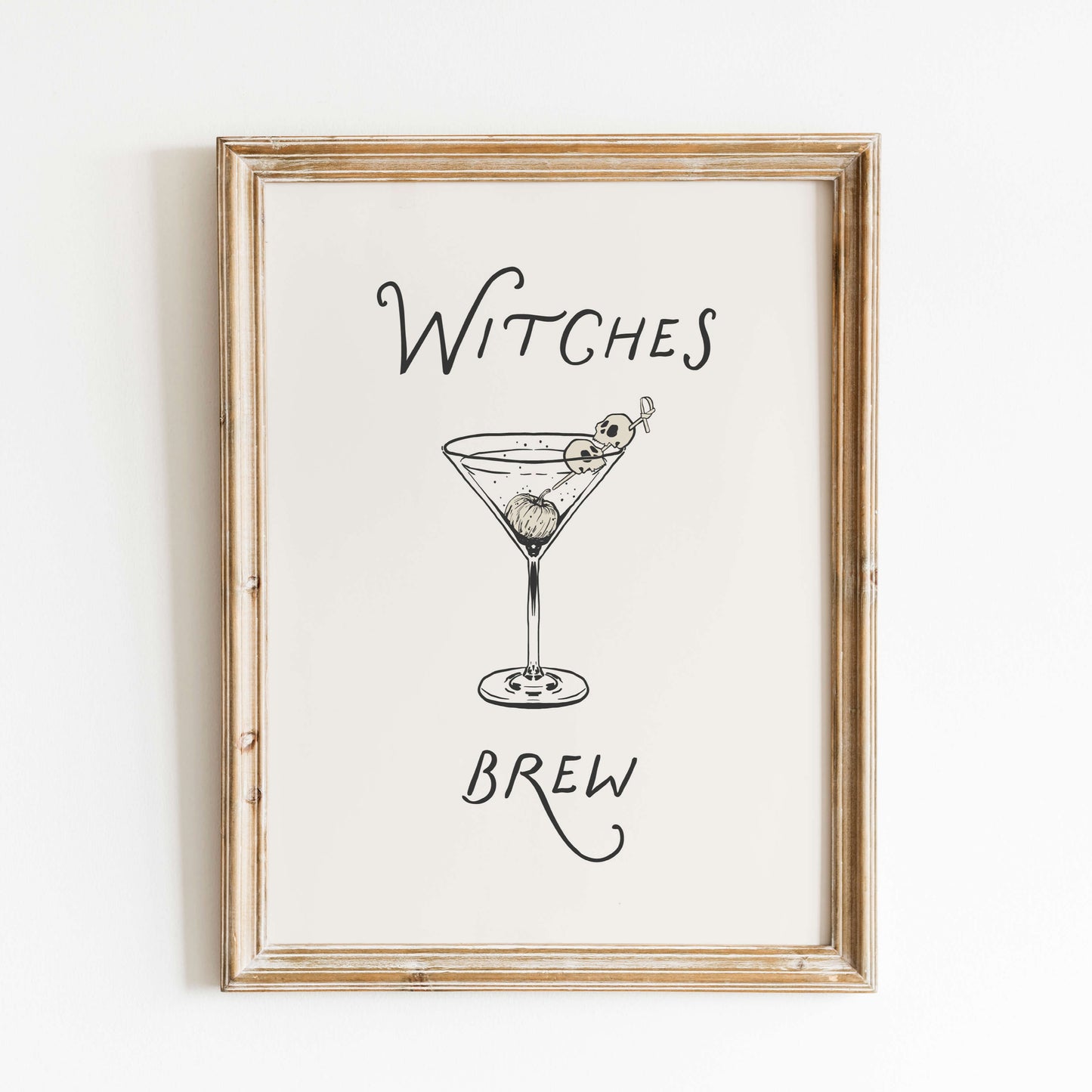 Framed artwork with a martini glass and text on a white background