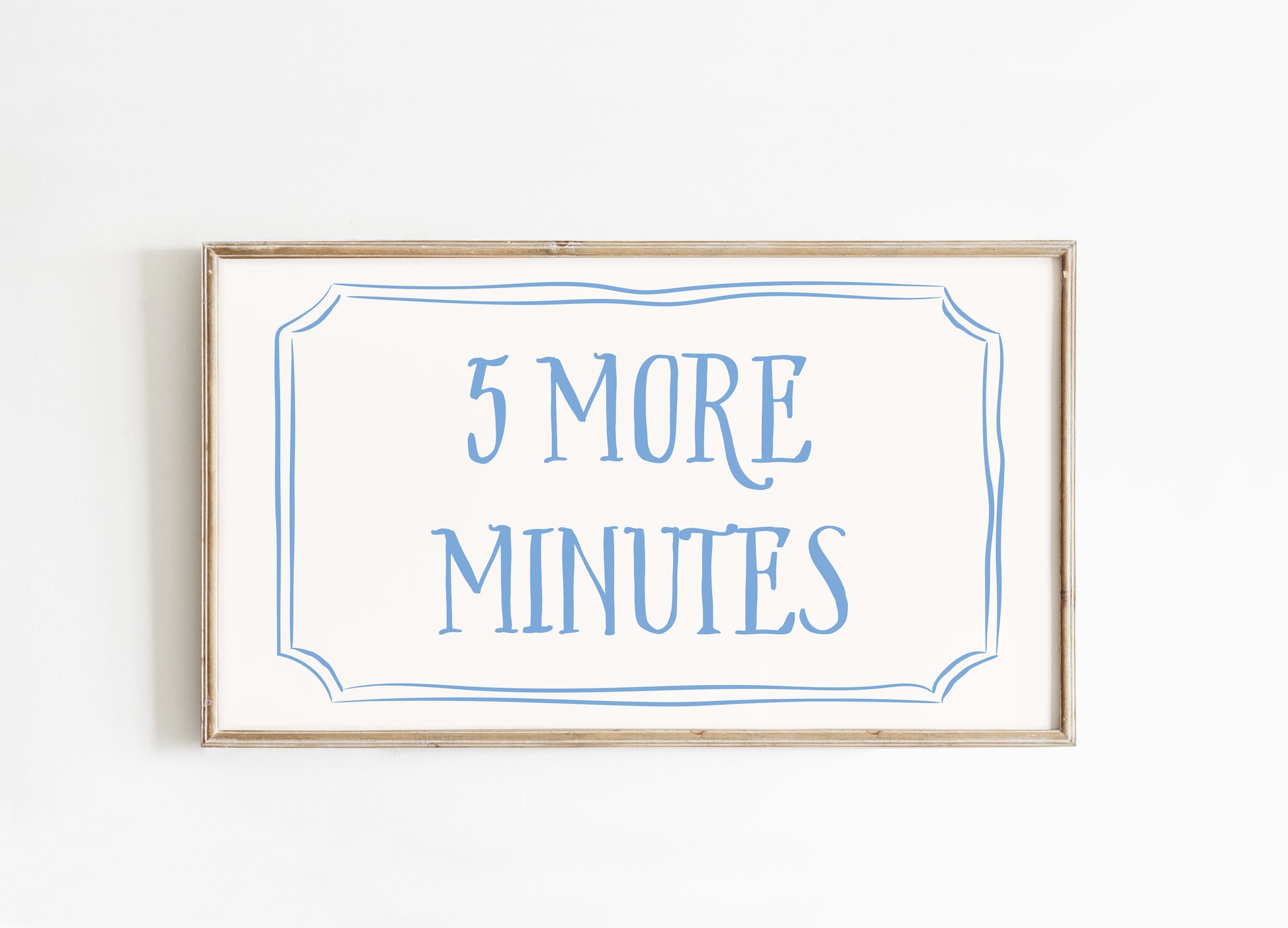 Framed sign with '5 More Minutes' text on a white background