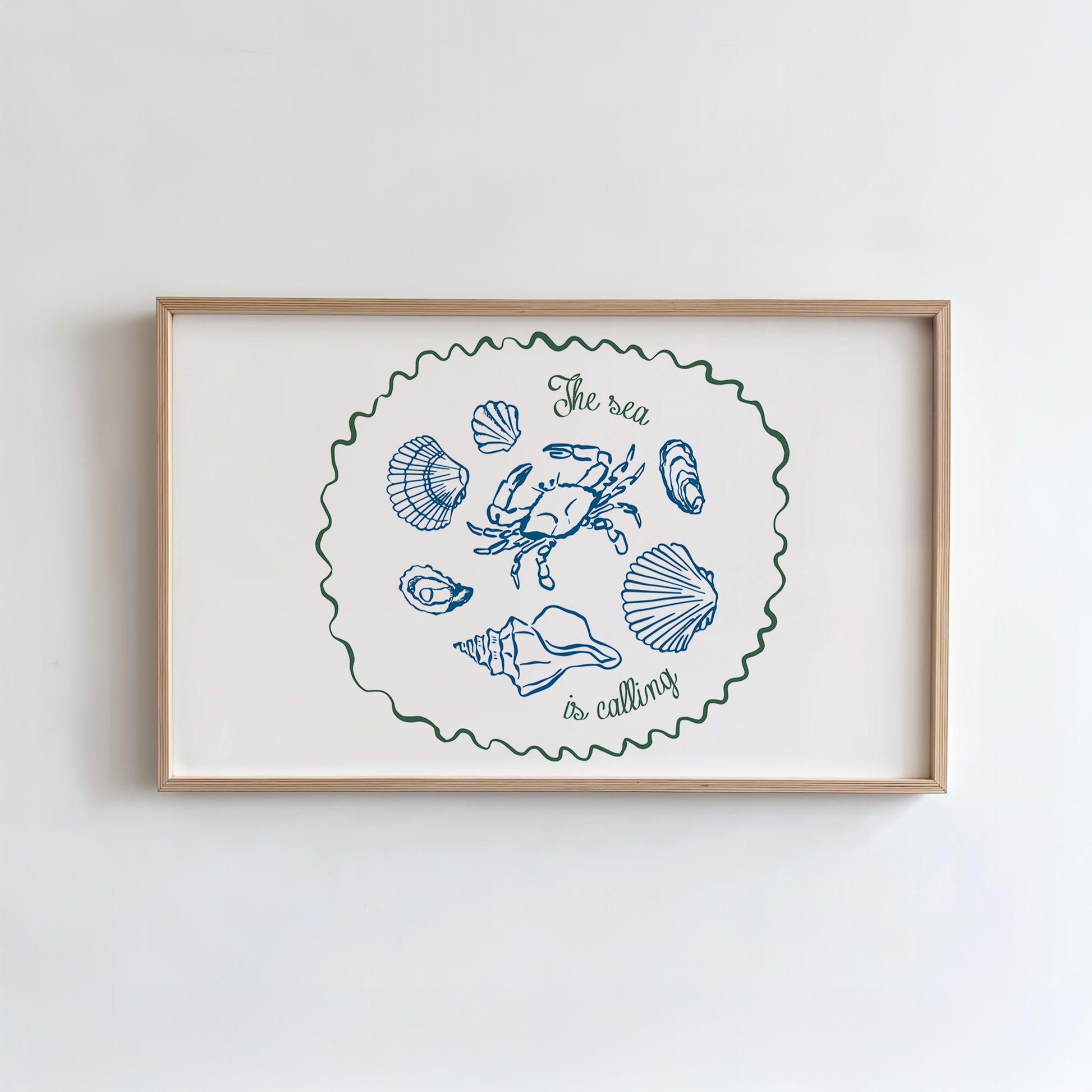 Framed artwork with coastal illustrations and text on a white wall