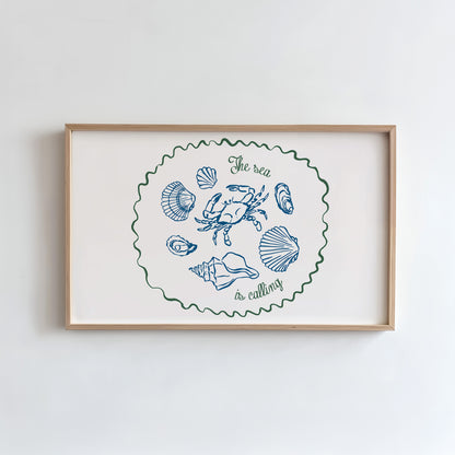 Framed artwork with coastal illustrations and text on a white wall