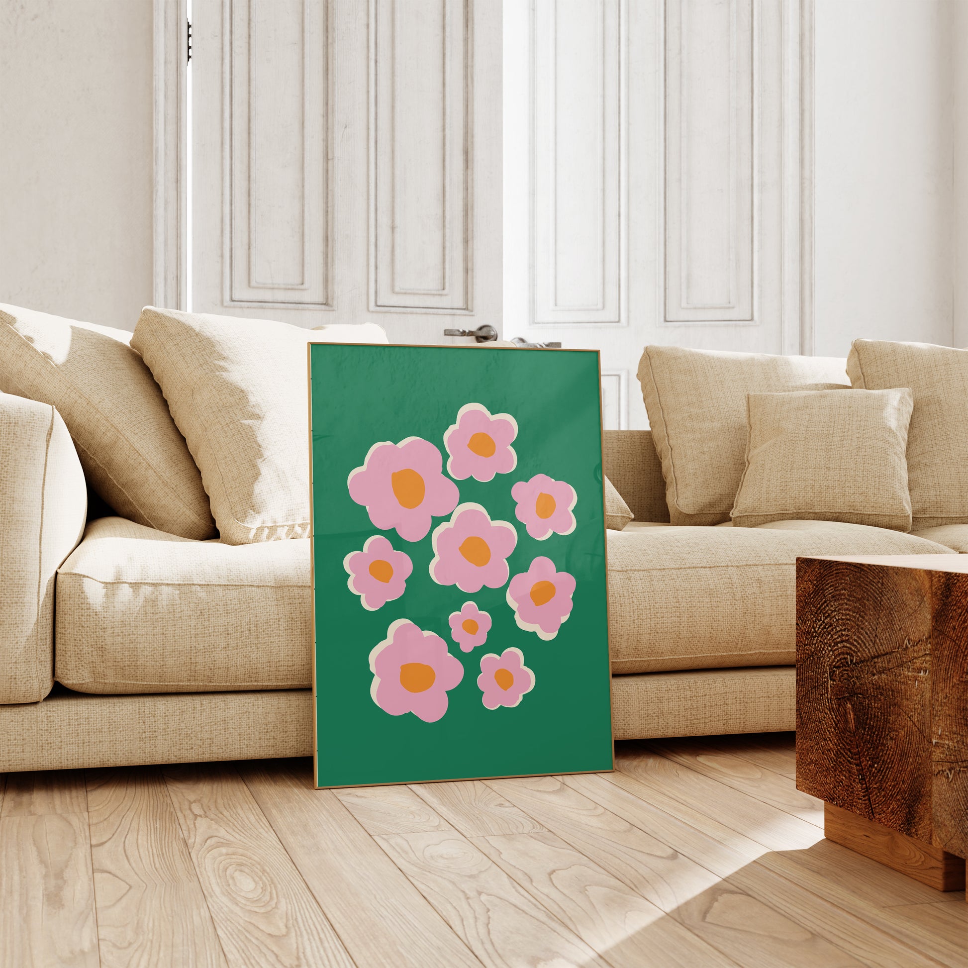 Floral painting on a green background in a living room setting