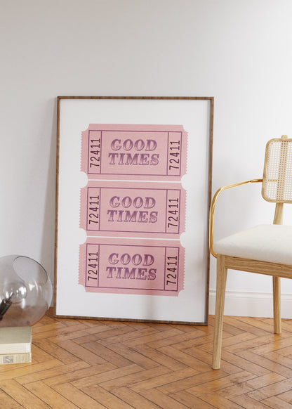 Framed print with 'Good Times' tickets in a room with a chair and decor items.